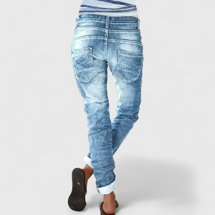 Slim fit women's acid wash denim skinny jeans, featuring unique contrast stitch and trendy vintage style.
