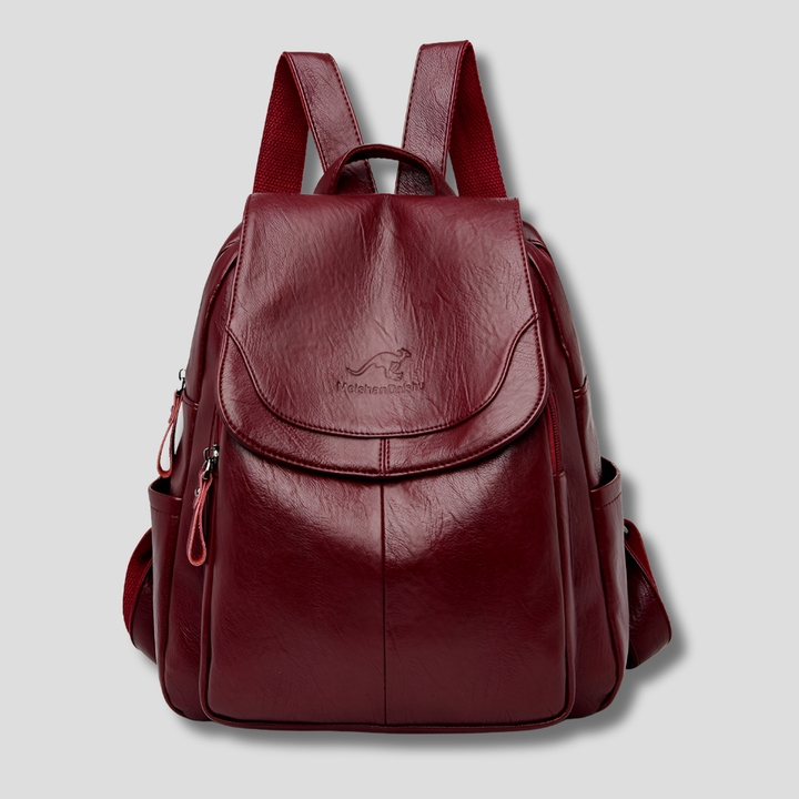 Anti-theft women's backpack featuring a secure, fashionable design. Leather-look travel bag with multiple pockets.