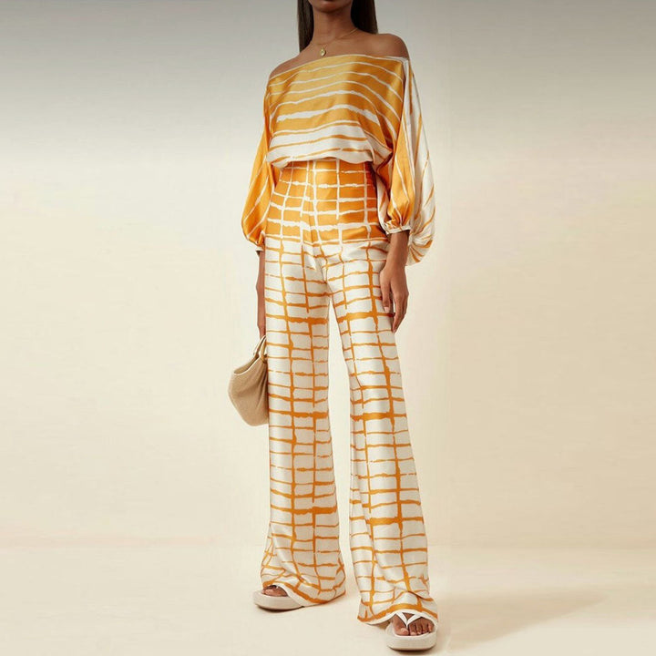 Elegant casual women's one-shoulder pants set with an abstract print, perfect for resort or summer events.