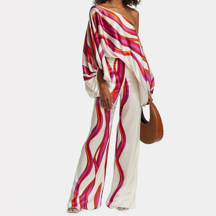 Elegant women's two-piece set featuring a unique artistic abstract print on flowy wide-leg pants. Vacation ready.