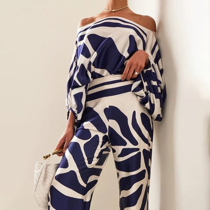Resort wear women's one-shoulder pants set with vibrant artistic print, ideal for elegant casual getaways.