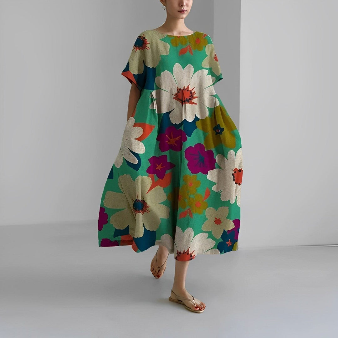 Comfortable women's relaxed midi dress with a beautiful artistic print. Short sleeve, round neck design for easy wear.