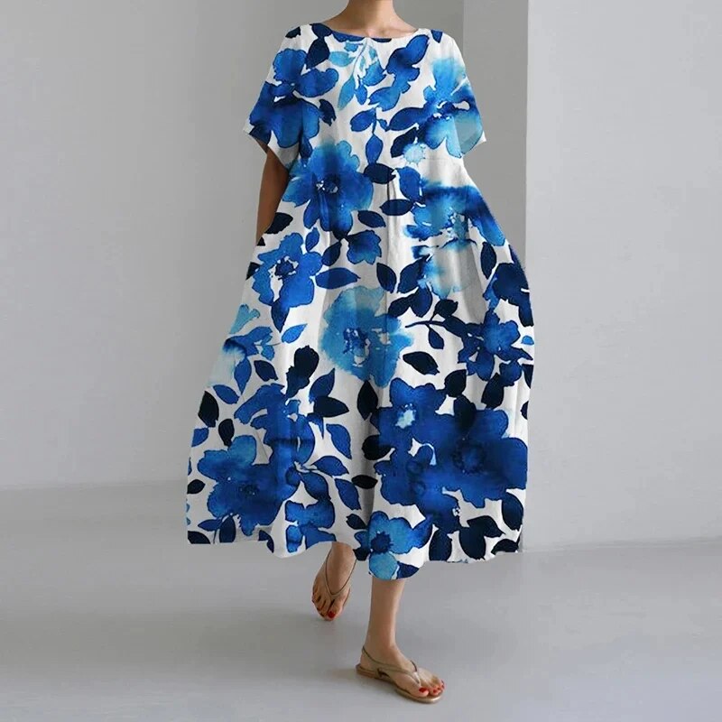 Relaxed fit women's midi dress, artistic print. Effortlessly stylish, flowy silhouette perfect for summer casual outings.