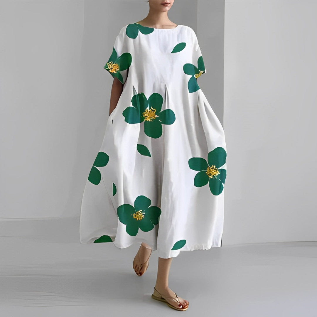 Casual women's midi dress featuring unique artistic print. Perfect vacation or summer outfit with a relaxed fit.