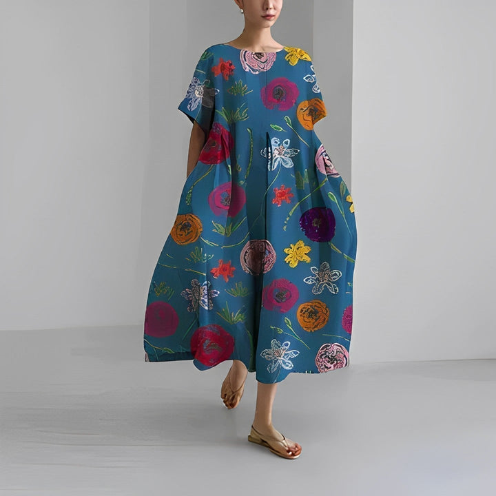Stylish women's relaxed midi dress, artistic print. A versatile round neck summer dress for casual or vacation looks.