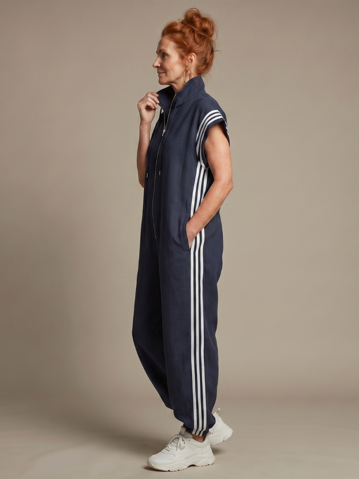 Effortless women's jumpsuit, black, with zip front and white sporty side stripes. Comfortable and fashionable.
