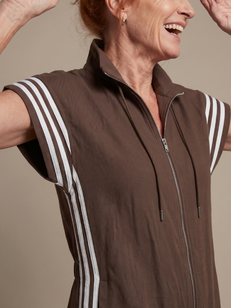 Fashionable women's full length jumpsuit, zip front, cap sleeve. Sporty side stripes add a chic touch.