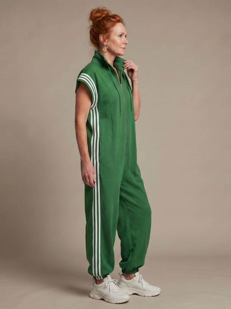 Relaxed fit women's casual jumpsuit, zip front, cap sleeve. Full length with trendy sporty side stripes.
