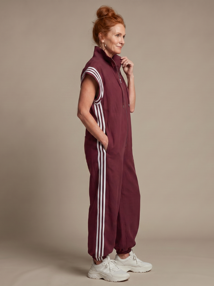 Effortless women's zip front jumpsuit, cap sleeve, full length. Sporty chic with side stripe detail, comfortable.