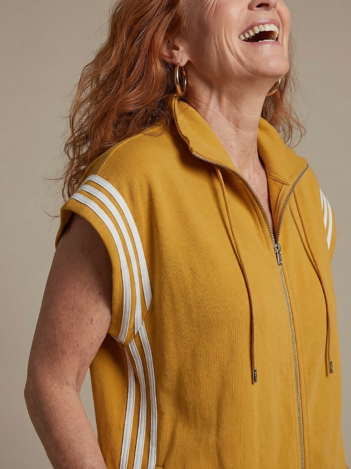 Sporty chic women's jumpsuit, cap sleeve, full length. Features zip front and elegant side stripe detail.