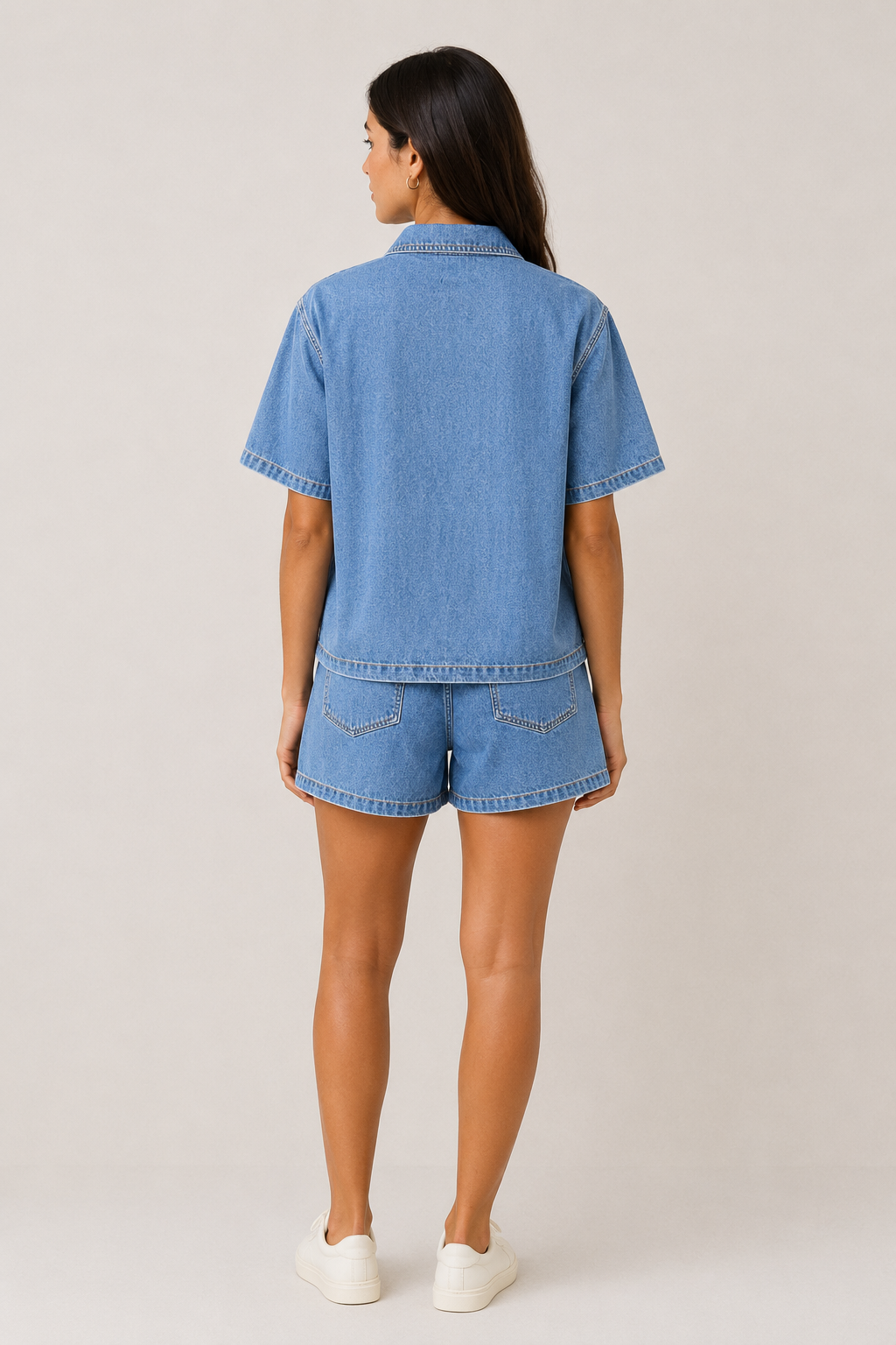Fashionable women's matching denim set, featuring a short sleeve jacket and shorts for versatile wear.