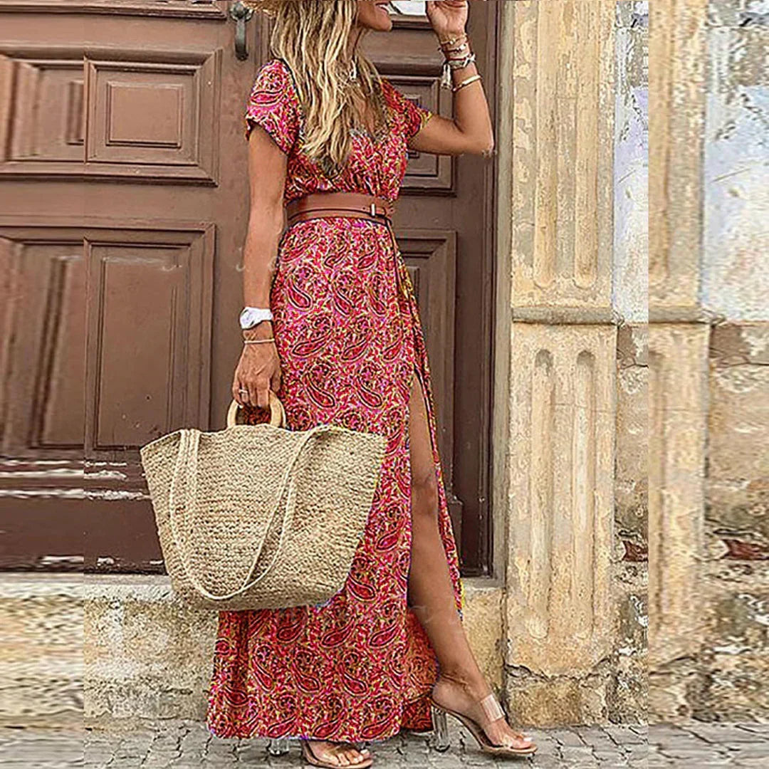 Women's vibrant Bohemian floral print maxi dress featuring a stylish side slit. Ideal for warm weather.
