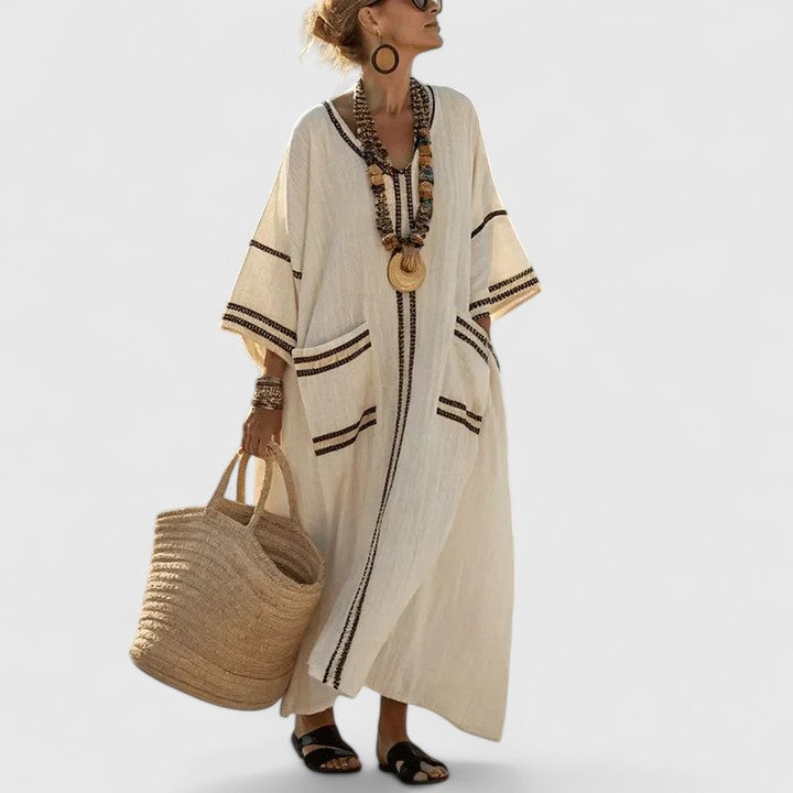 Stylish women's summer maxi dress with a bohemian print and convenient side pockets.