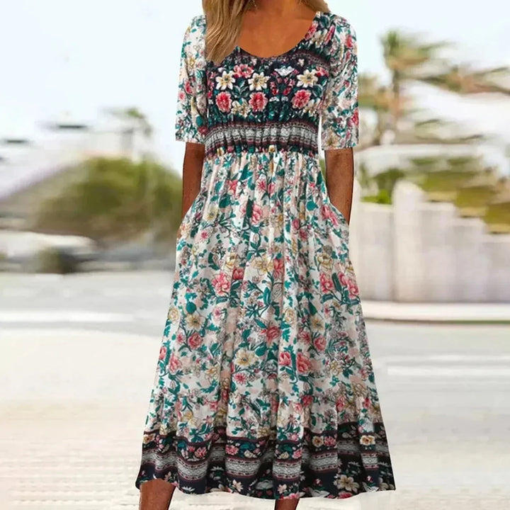 Everyday women's short sleeve bohemian midi dress. Features a casual printed design and practical pockets for summer.