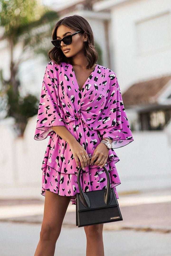 Bohemian women's off-shoulder mini dress with an elasticized neckline, great for everyday or holiday wear.