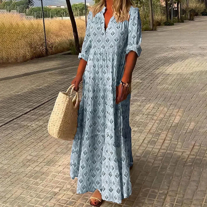 Women's Bohemian V-neck maxi dress with long sleeves, flowing fabric, perfect for summer casual or beach wear.