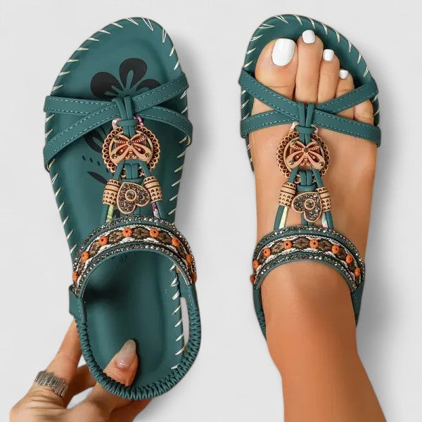 Stylish women's casual flat sandals with a Boho design, featuring beaded & rhinestone embellishments and a toe ring.