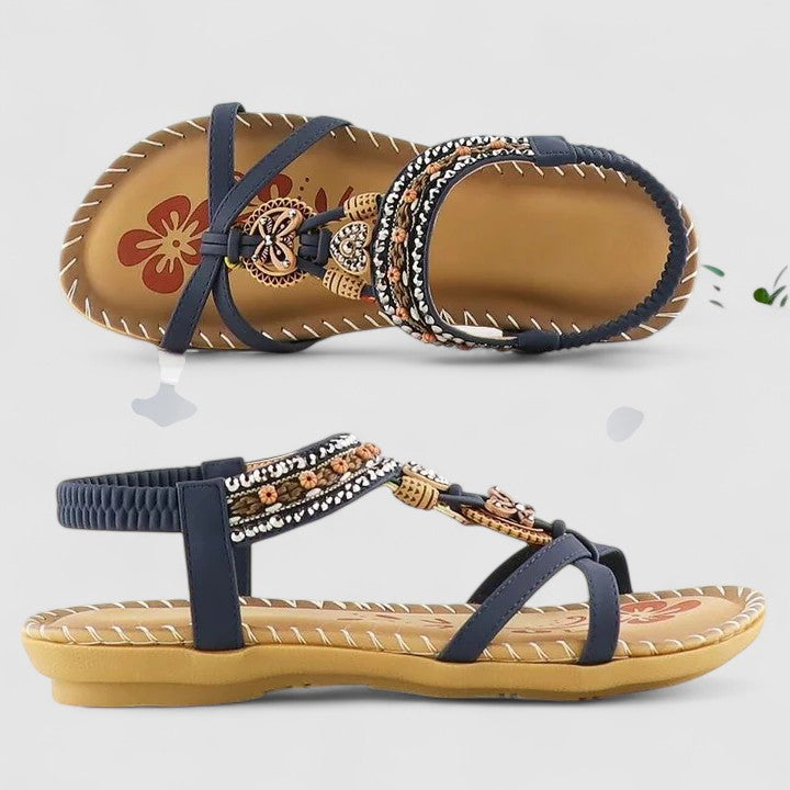 Sparkling women's flat Boho sandals with intricate beaded and rhinestone details, a comfortable toe ring design.