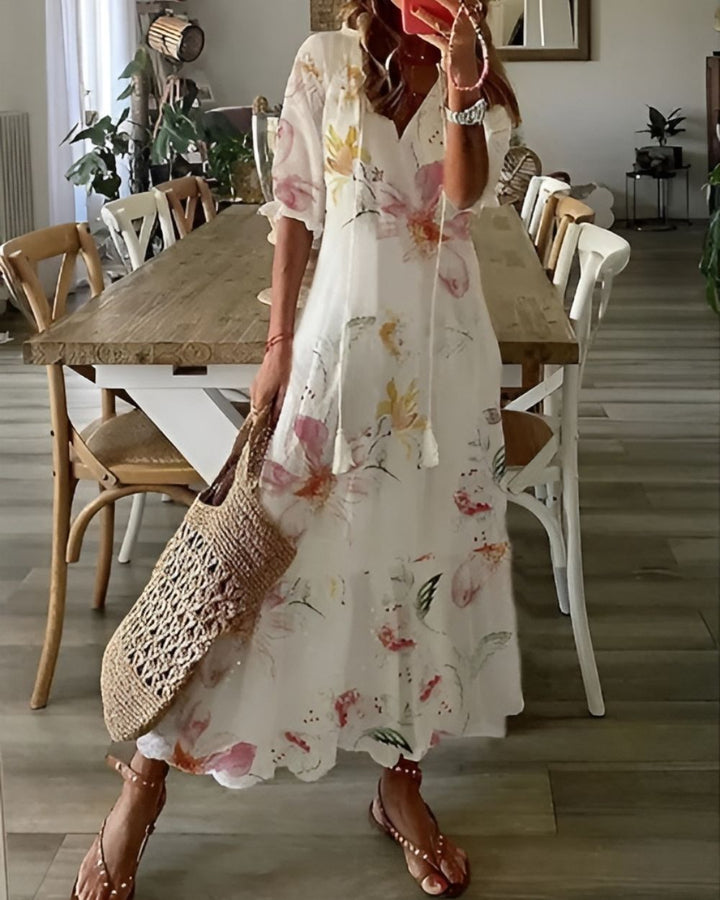 Vibrant floral printed maxi dress for women, perfect for a bohemian summer look.