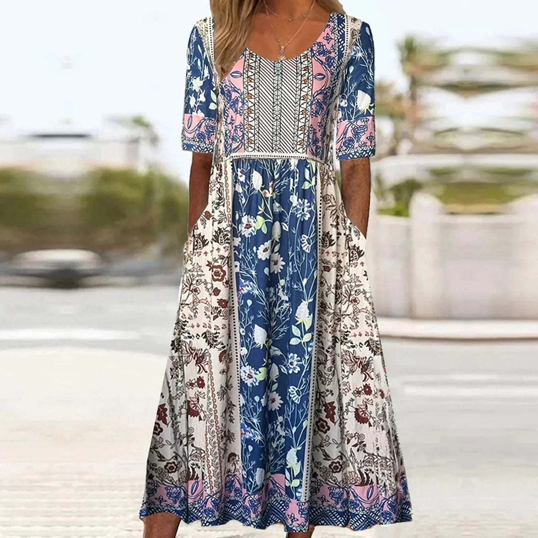 Flowy women's boho floral maxi dress. Features short sleeves, a stylish square neck, great for summer fashion.