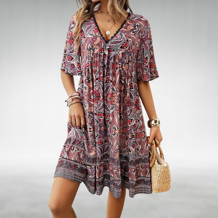 Vibrant women's short-sleeve boho mini dress with an eye-catching paisley print, great for summer casual & vacation.