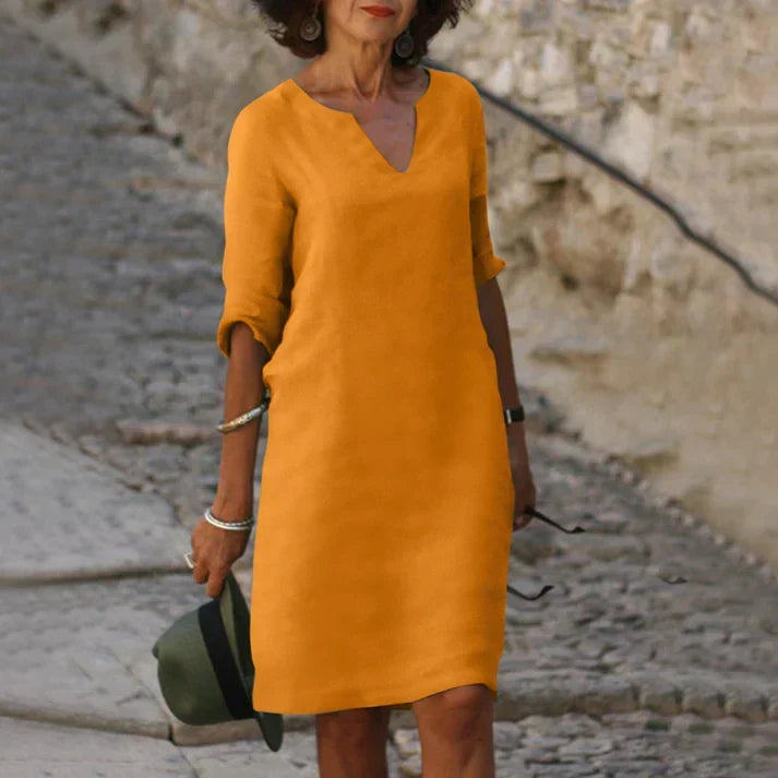 Versatile women's midi dress: V-neck, short sleeve, breezy. From casual day dress to elegant summer fashion.