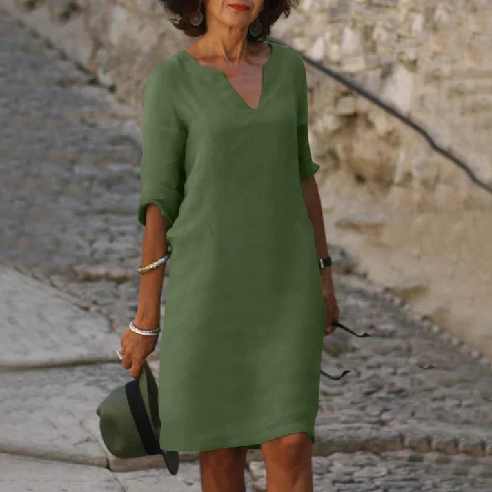 Women's casual V-neck midi dress with short sleeves and a breezy, flowy silhouette. Ideal comfortable day dress.