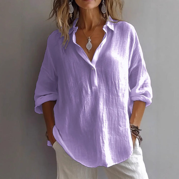 Fashionable women's wide-sleeve button-down top, offering chic comfort for any occasion.