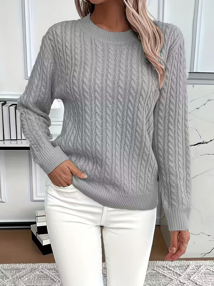 Stylish women's cable knit crew neck jumper, easily transitions from casual to smart autumn looks.
