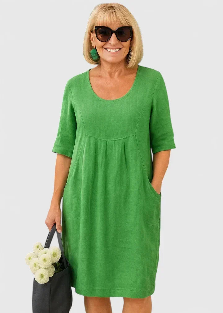 Women's casual A-line midi summer dress with convenient pockets, perfect for everyday comfortable style.
