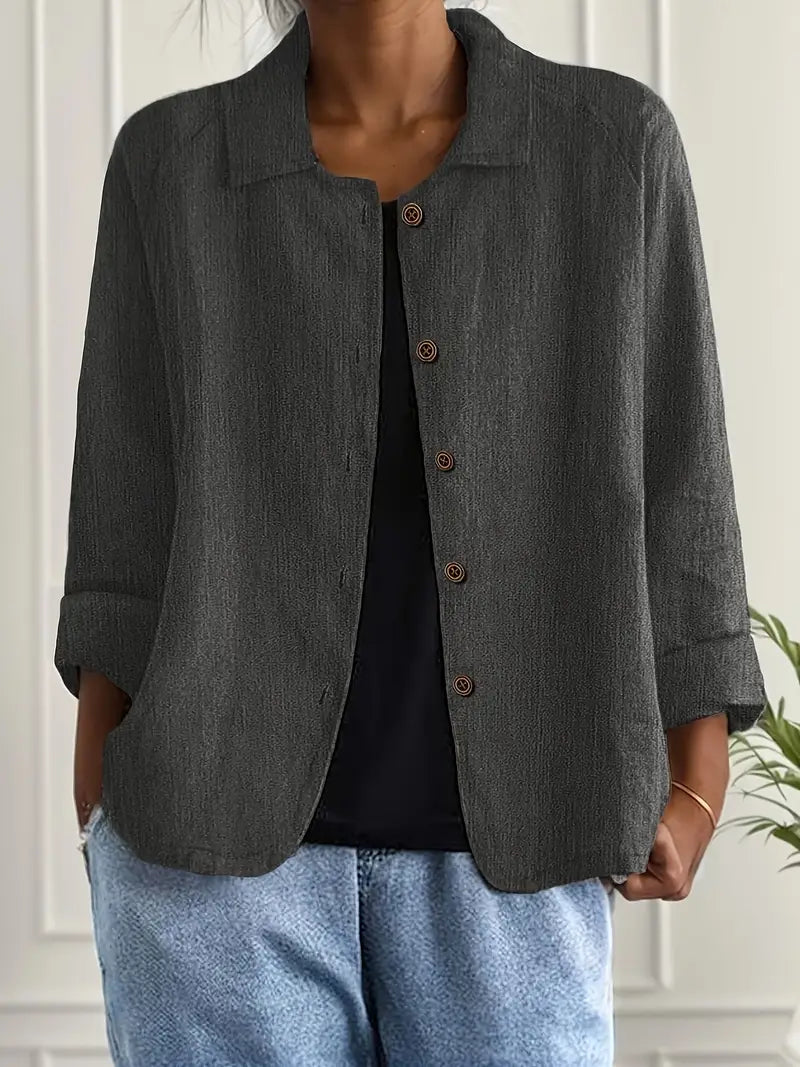 Comfortable women's relaxed fit button-front top with three-quarter sleeves, ideal for casual everyday style.