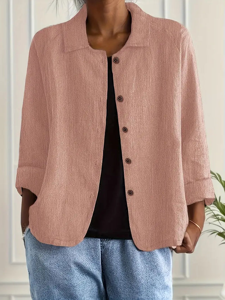 Women's collared button-front top with three-quarter sleeves, relaxed fit for versatile everyday wear.