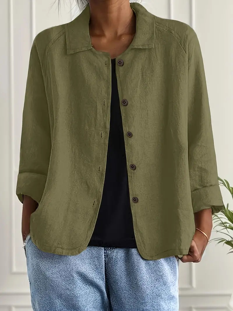 Close-up of the button-front and collar on a women's relaxed fit casual top, three-quarter sleeve.