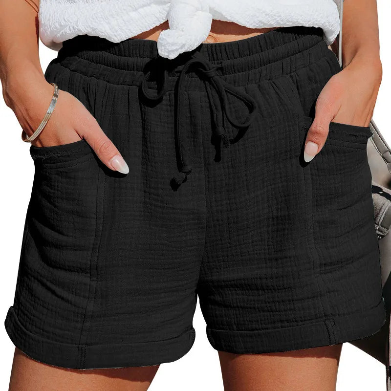 Relaxed fit women's drawstring shorts, ideal for vacation or casual summer outings, featuring convenient pockets.