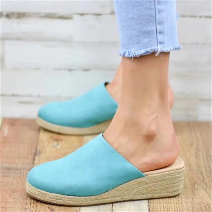Women's comfortable everyday slip-on sandals. Flat open-toe design, perfect lightweight casual summer footwear.