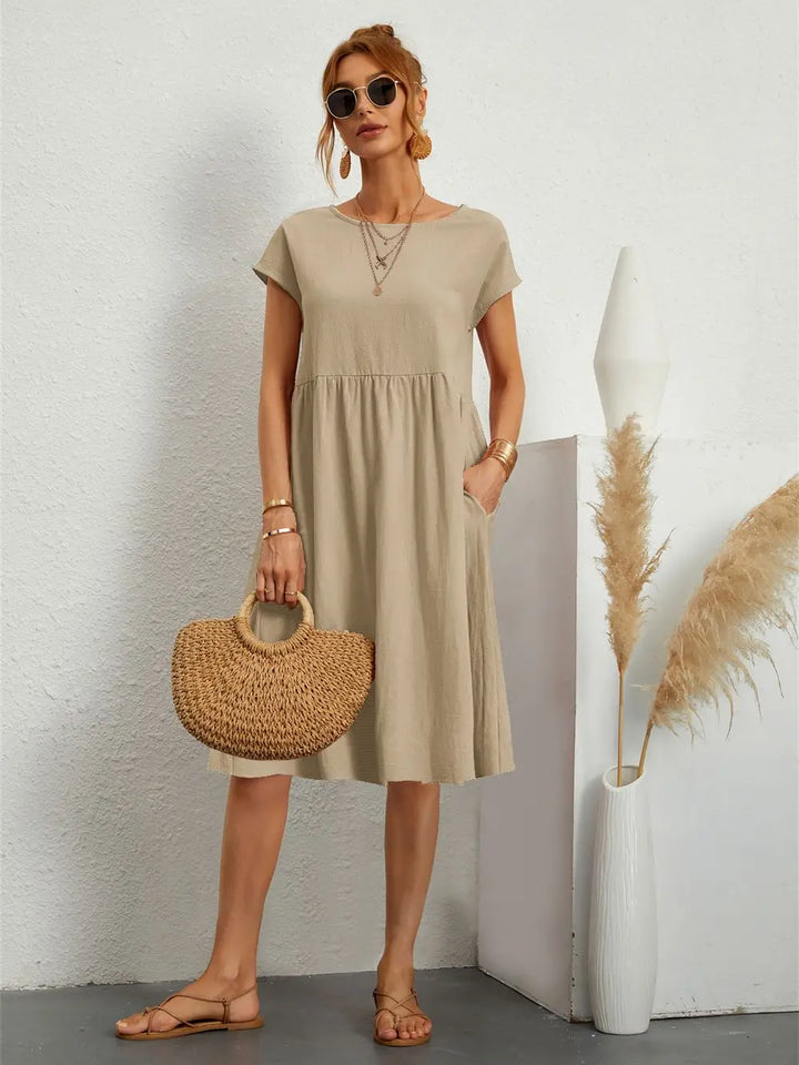 Relaxed fit women's midi dress, short sleeves, designed for spring & summer comfort & versatile style.