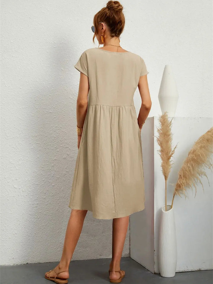 Comfortable women's casual midi dress, relaxed fit, styled for versatile everyday spring fashion.
