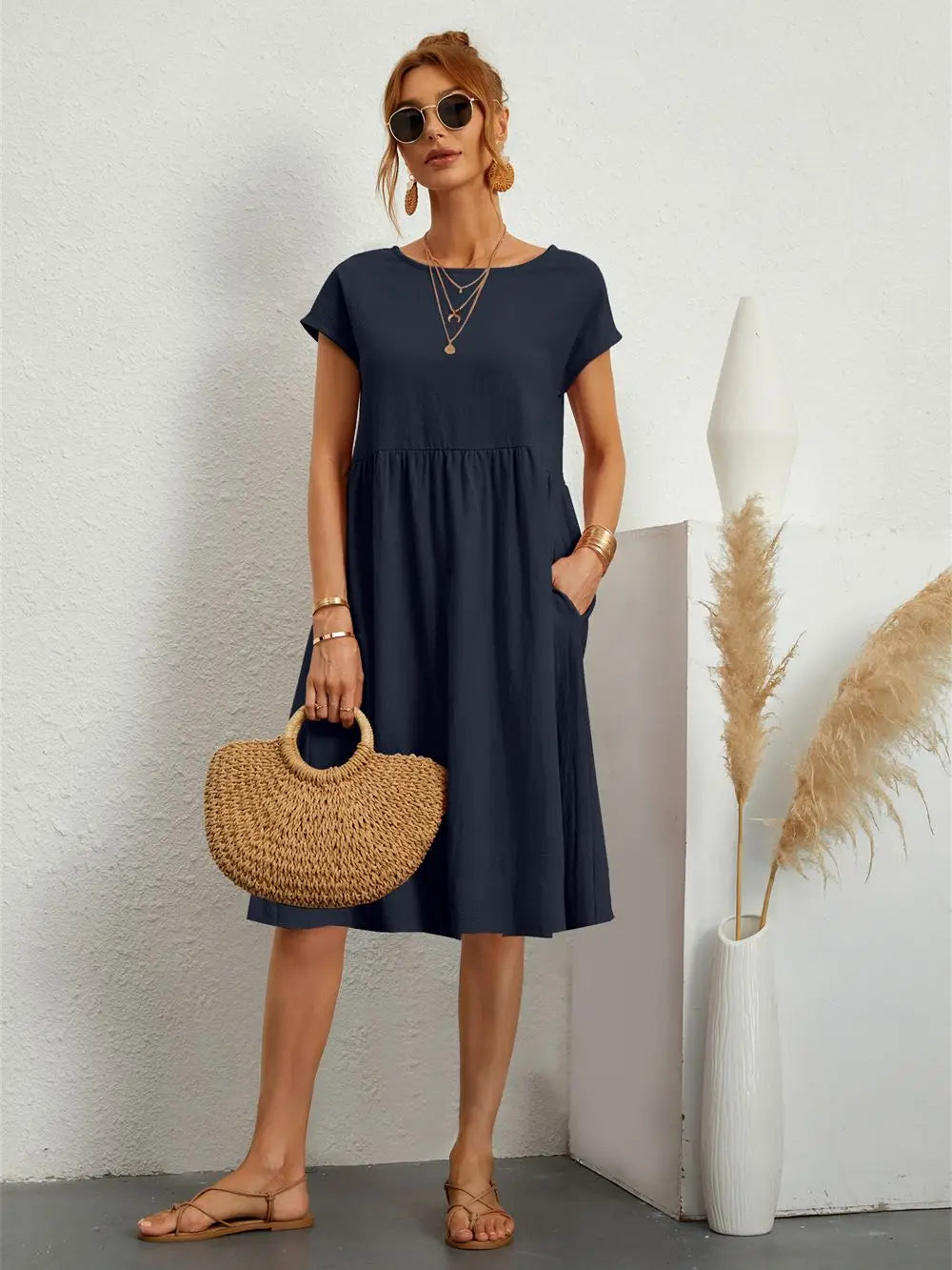 Ladies' short sleeve midi dress with pockets, elegant length, ideal for casual summer outings.