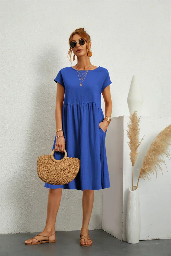 Versatile women's midi dress with pockets & short sleeves, styled for effortless spring casual wear.