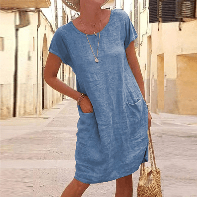 Versatile women's casual mini dress, relaxed fit, pockets, short sleeve. Ideal for comfortable everyday wear.