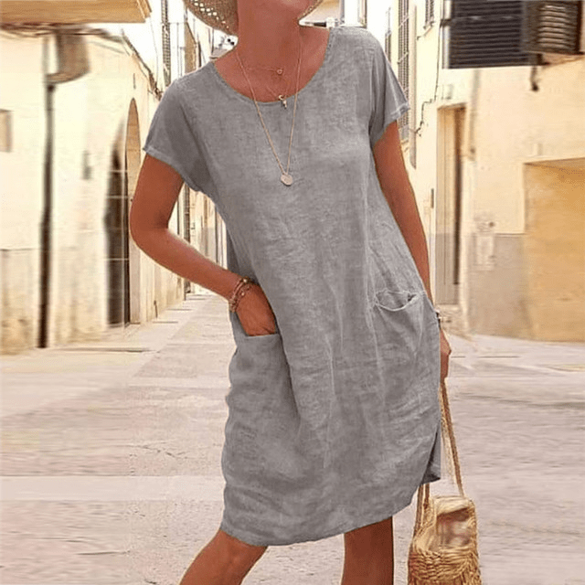 Stylish women's casual pocket mini dress, relaxed fit, short sleeve & round neck. Great for easy everyday fashion.