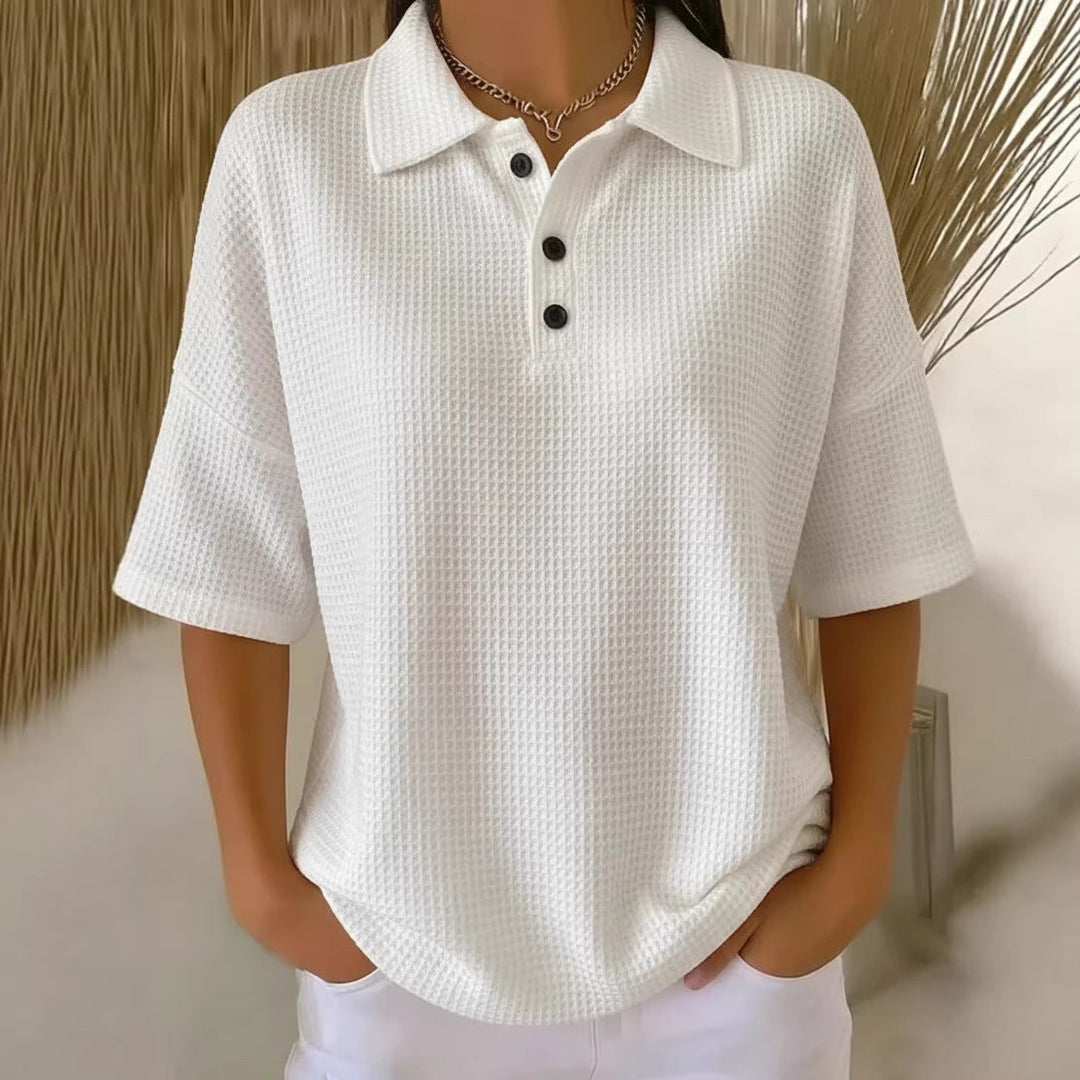 Stylish women's polo neck top. Loose fit, short sleeves, perfect for relaxed spring & summer fashion.