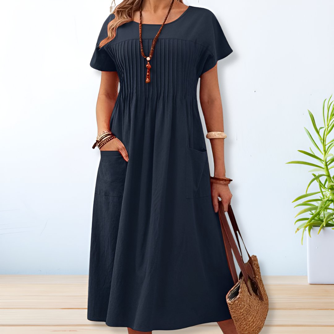 Stylish women's relaxed fit midi dress with pockets, offering ultimate comfort for everyday casual outings.
