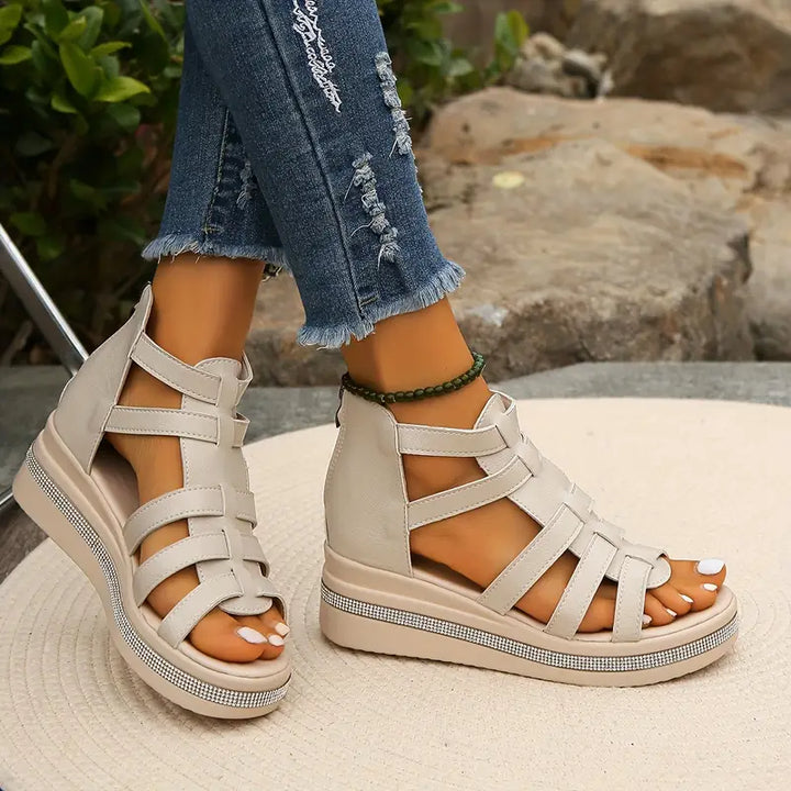 Close-up of women's comfortable wedge sandals, ideal casual summer footwear.