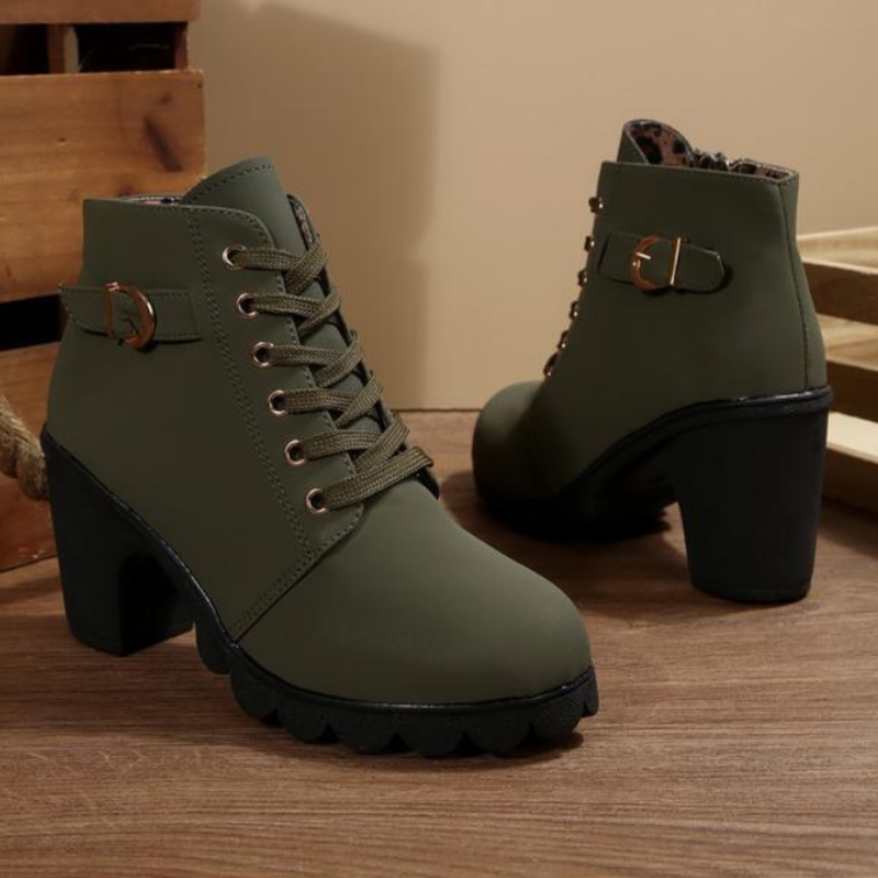 Chic women's fashion ankle boots. Black lace-up design with chunky heel, ideal for stylish casual autumn outfits.