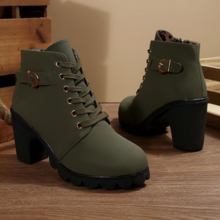 Chic women's fashion ankle boots. Black lace-up design with chunky heel, ideal for stylish casual autumn outfits.