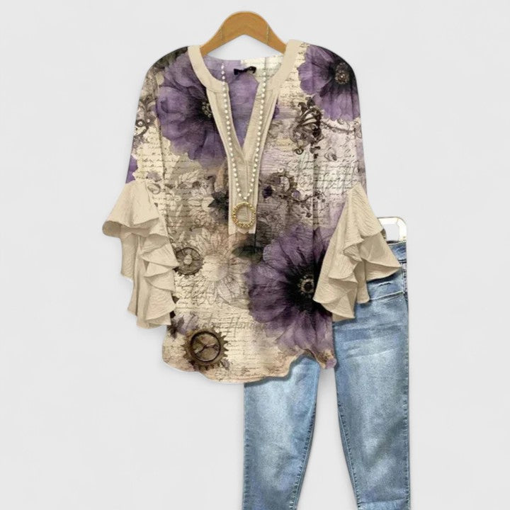 Versatile women's floral blouse with chic ruffled sleeves, offering both style and comfort.