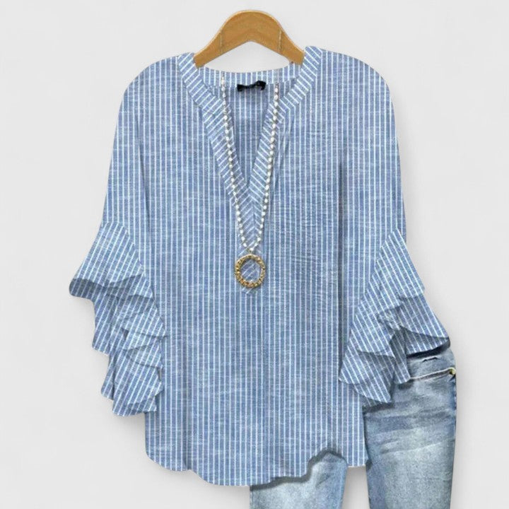 Comfortable women's floral blouse with chic ruffled sleeves, versatile for casual or dressed-up wear.
