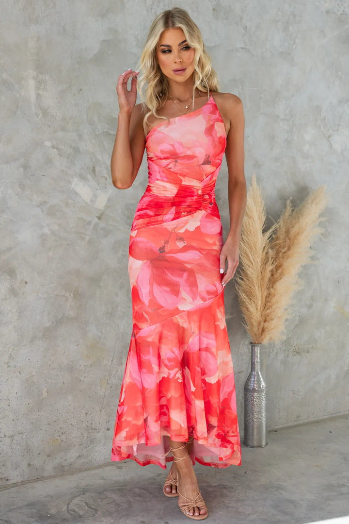 Comfortable & chic one-shoulder floral maxi dress. Elegant women's special occasion apparel, ideal for summer guests.