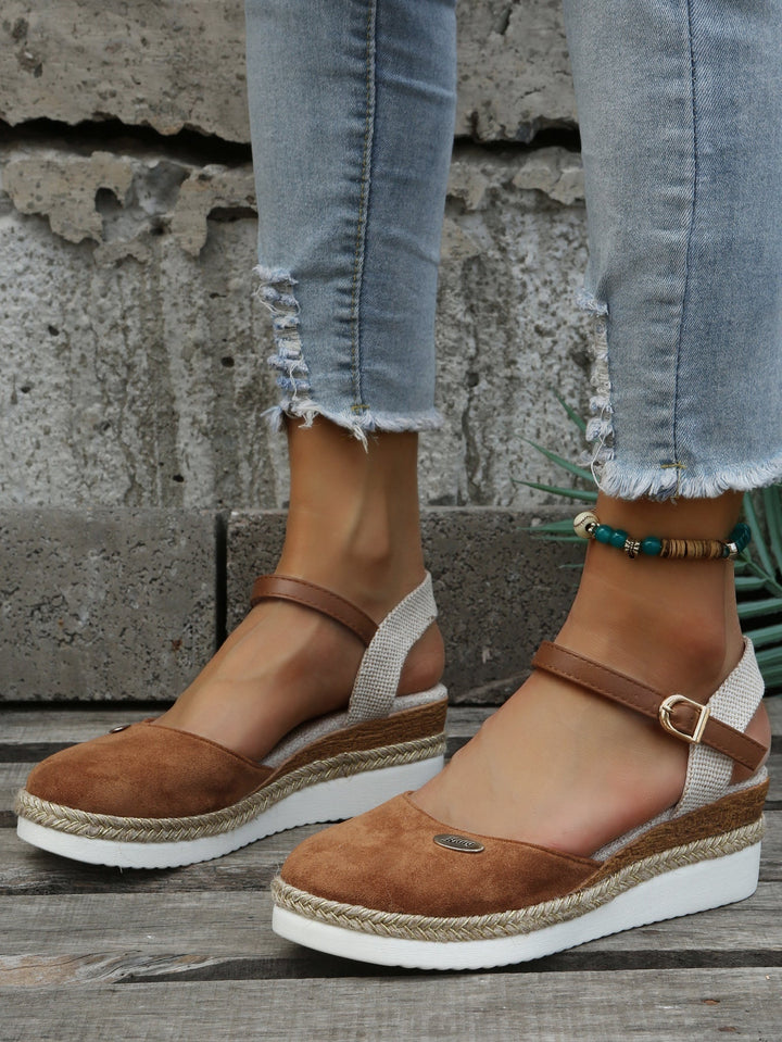 Women's elegant closed-toe platform espadrille sandals. Chic and comfortable summer footwear for any occasion.